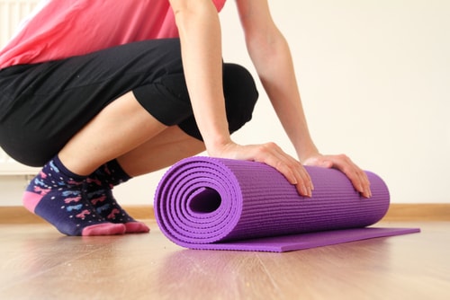 woman with yoga mat woman with yoga mat